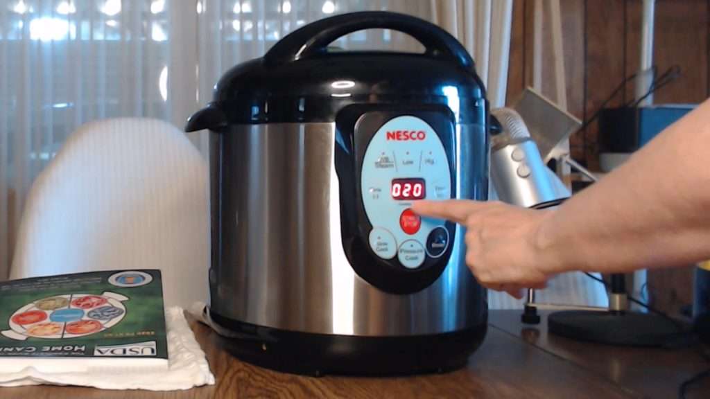Inputting the time on the Nesco electric canner.