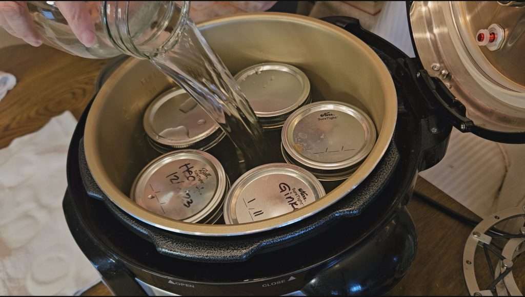 Pouring water into the Nesco or Carey smart canner