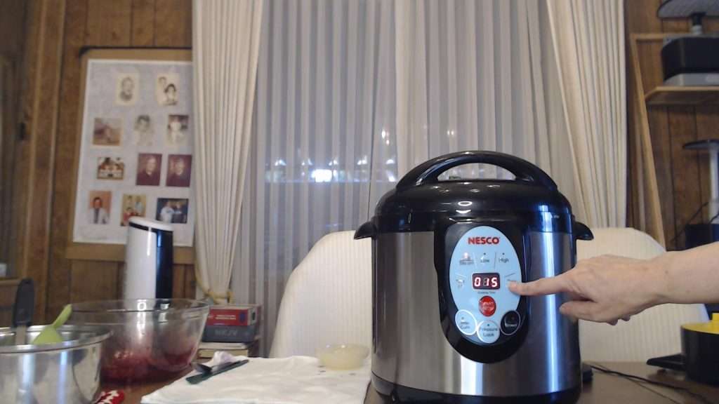 The Nesco canner set for 15 minutes, which is the proper processing time for canning pints of blueberries.
