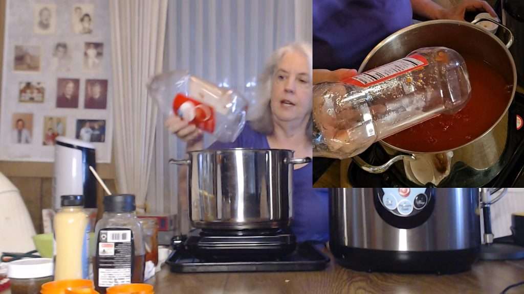 empty ketchup bottle after pouring the wet ingredients into the pot