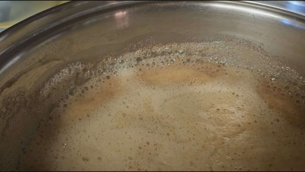 Simmering grape puree.