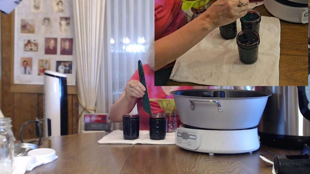 Using a headspace tool to check the headspace. When canning blueberry jam, you need to leave 1/4" headspace.