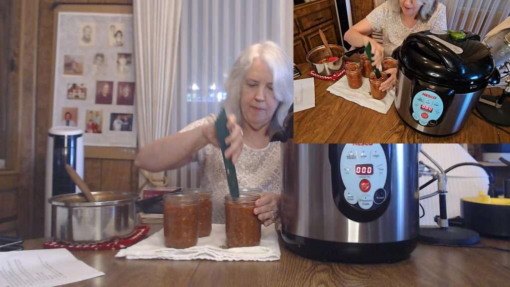 Debubbling canning jars filled with sloppy joes.