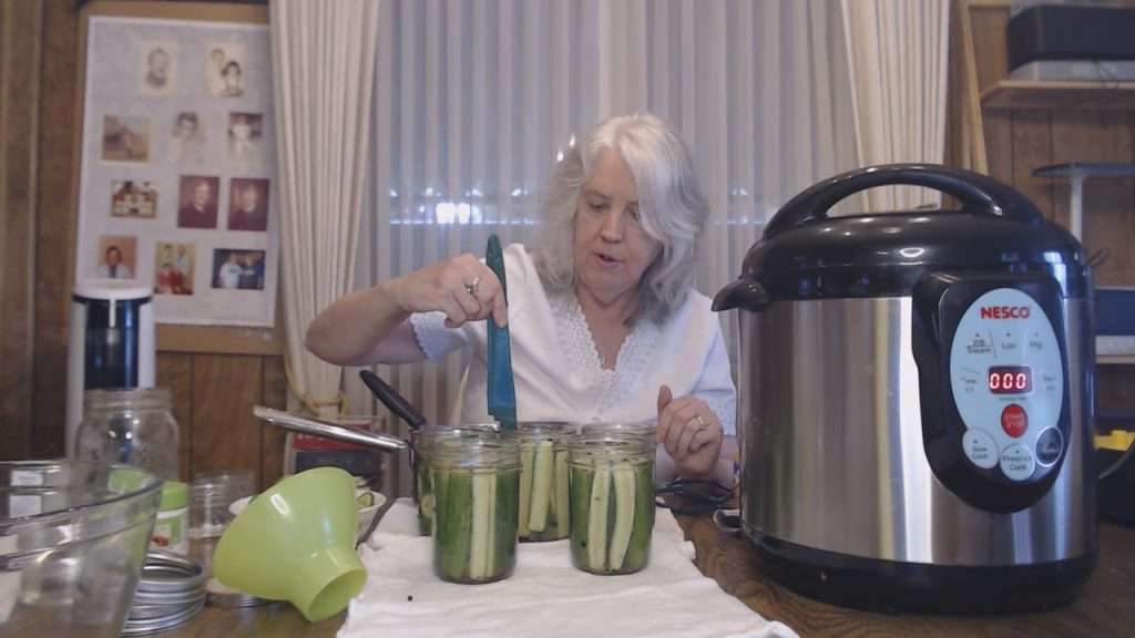 Checking the headspace on the jars.