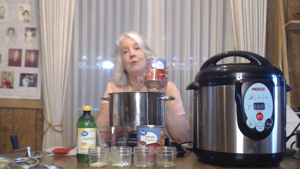 Holding up a can of tomato puree
