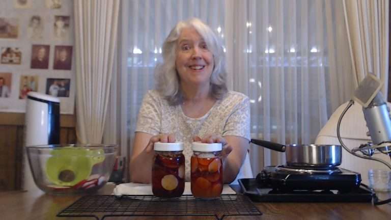 smiling with two pints of quick pickled radishes