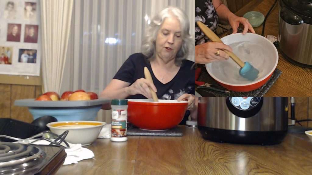 stirring the produce protector in a bowl filled with water.