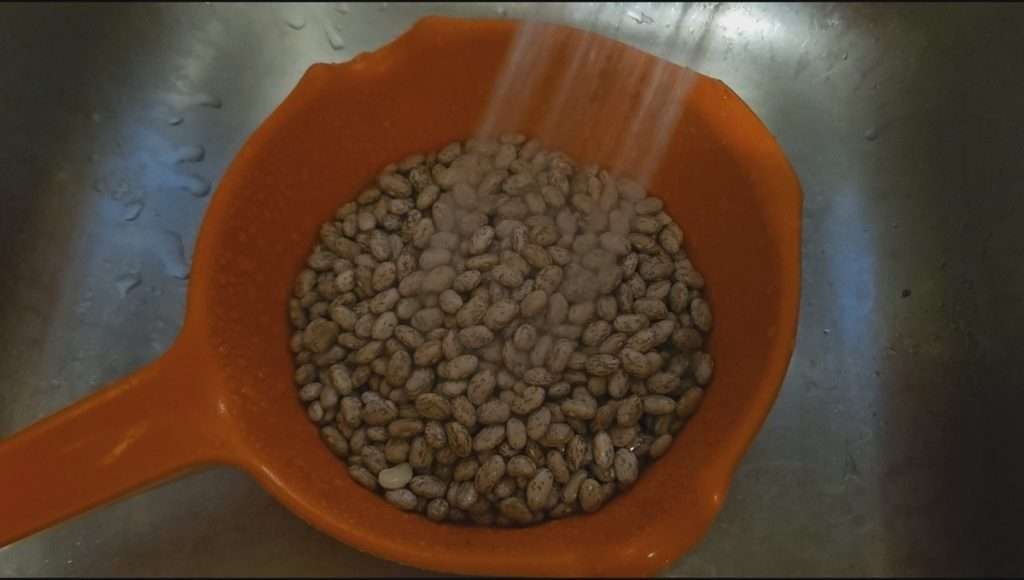Rinsing 3 cups of dried pinto beans