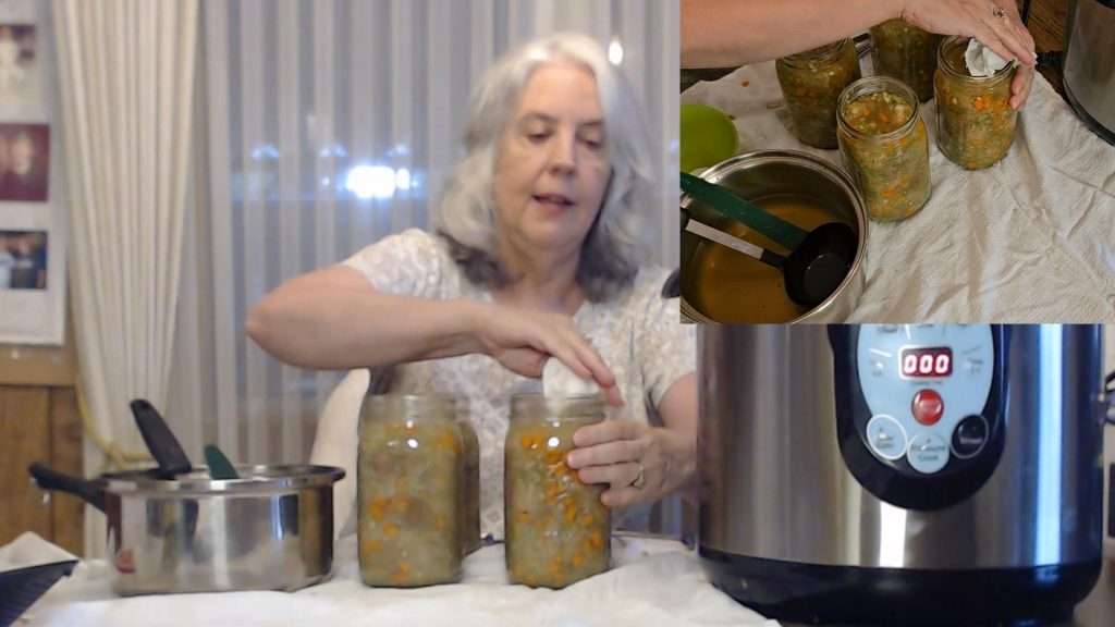 wiping canning jar rims with a paper towel dipped in vinegar.
