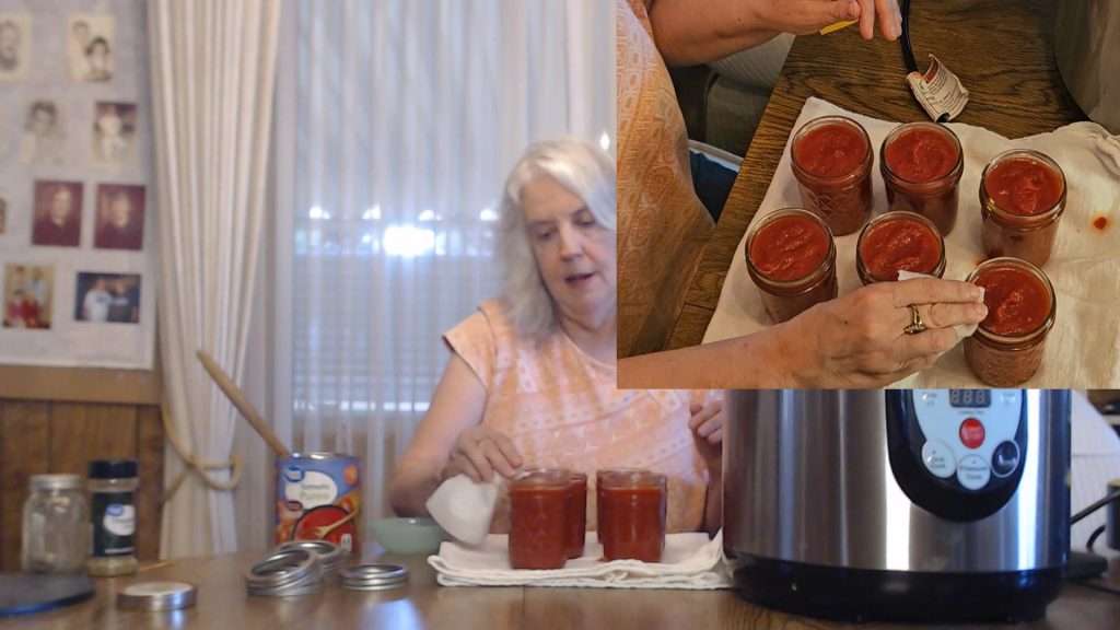 wiping the rims of canning jars with a damp paper towel.