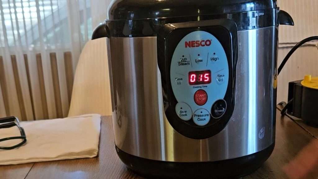15 minutes displayed on the Nesco canner.