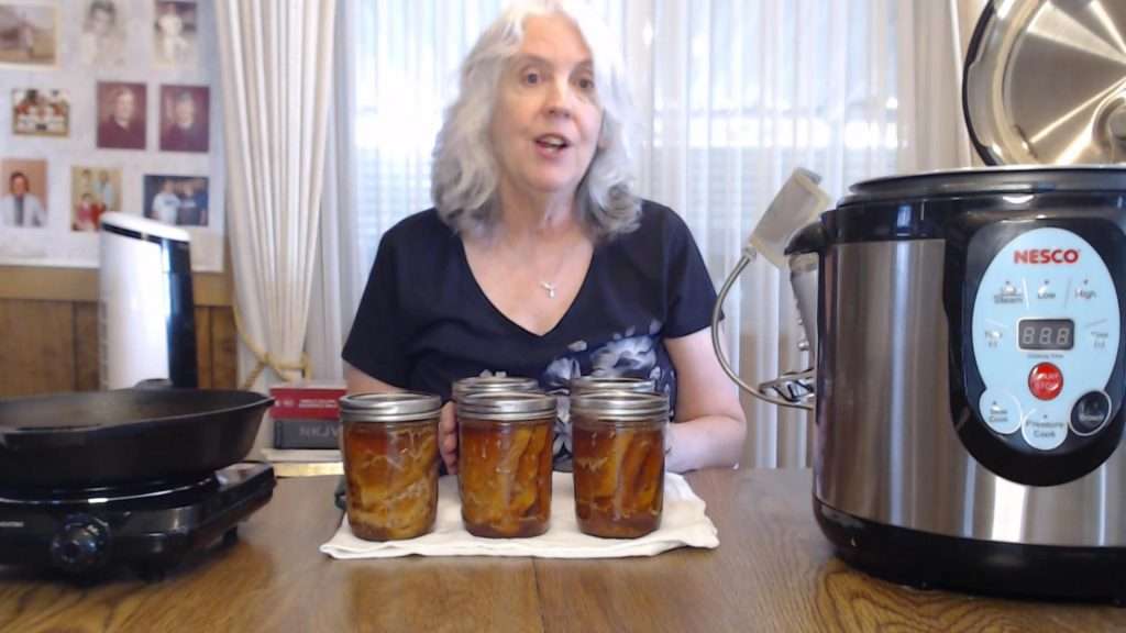 finished home canned pork chops in a pint size canning jars