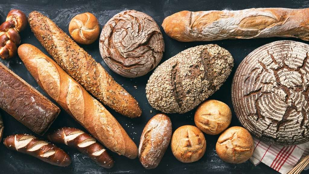 Loaves of homemade bread, made with whole grains.
