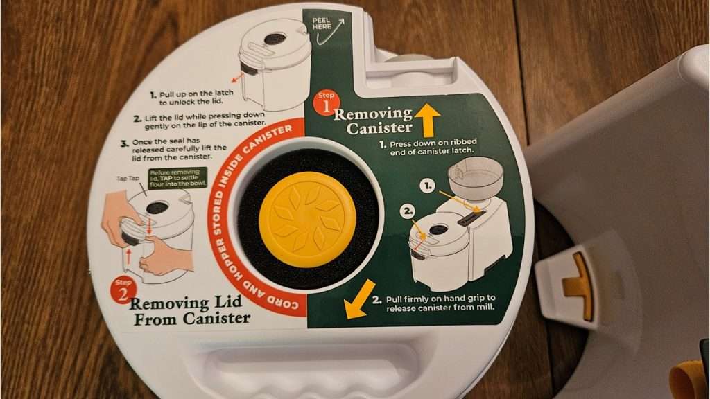 Close-up of printed instructions on the NutriMill canister.