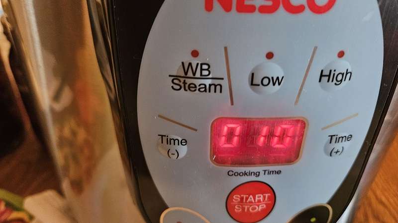 Digital display on Nesco canner showing 10 minutes on high