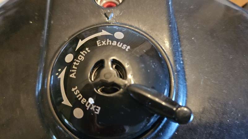 Nesco pressure canner with black 10-lb weight in exhaust position