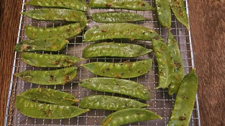 seasoned snow peas on a dehydrator tray