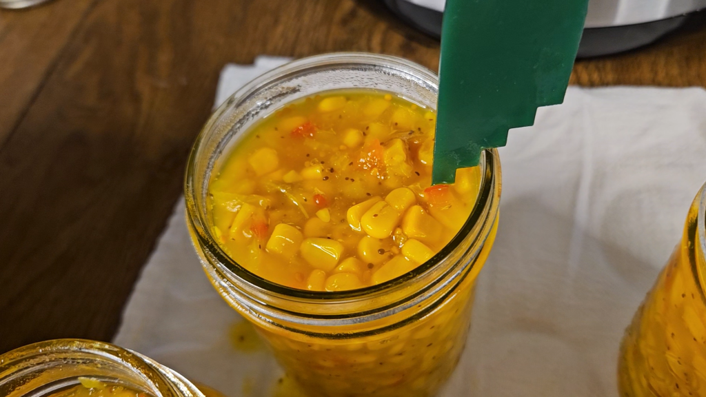 Checking the headspace. When canning corn relish, leave 1/2" headspace.
