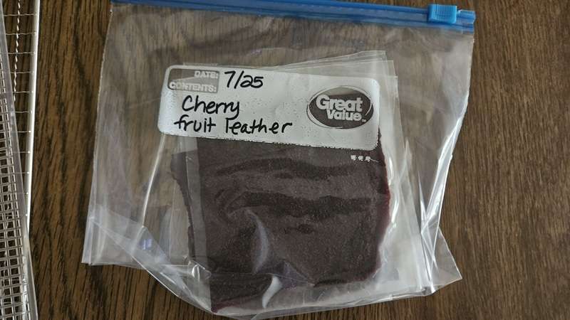 The cherry fruit leather that was cut into 4ths and placed on wax paper in a sealed ziptop bag.