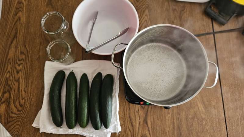 all the items needed for blanching cucumbers in preparation for dehydrating them.