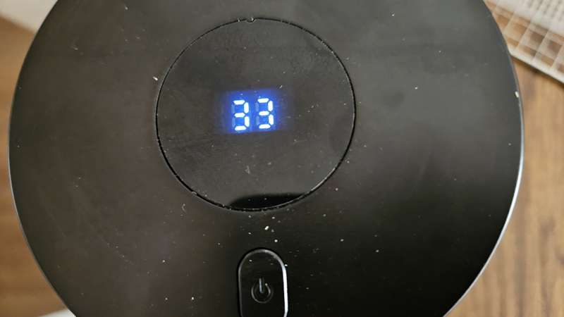A top view of the mason jar vacuum sealer with a digital display showing 33 which indicates the vacuum sealer had been running for 33 seconds.