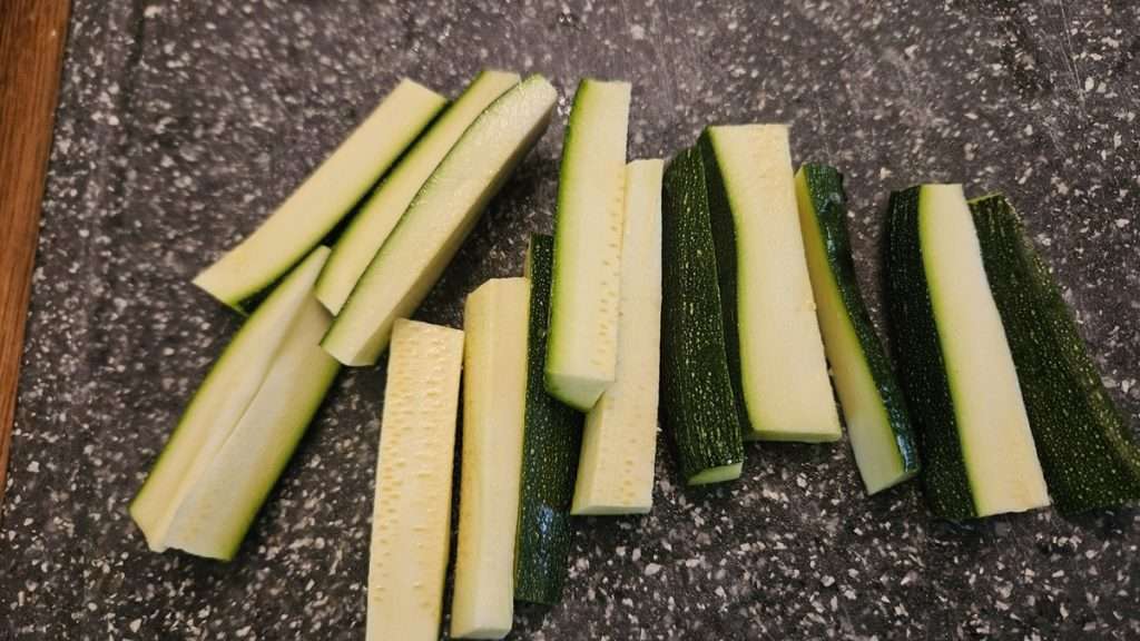 When planning to freeze breaded zucchini, cut the zucchini into 1/2" spears.
