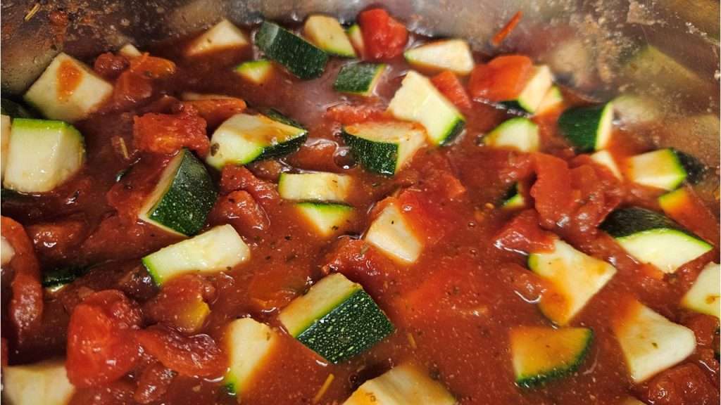 zucchini stirred into tomato mixture