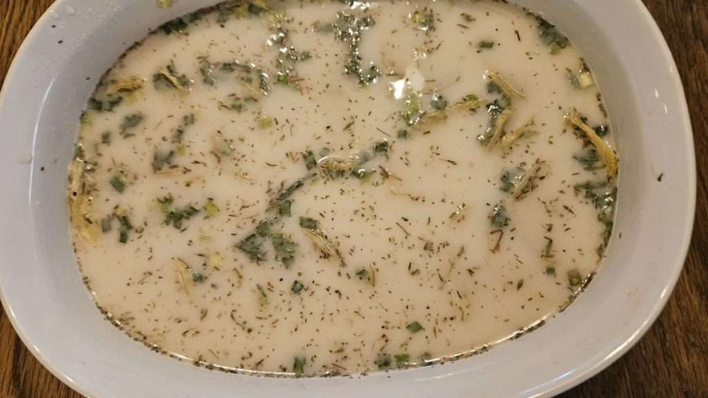 The casserole dish that has the potatoes with the sauce poured over the top. You cannot see the potatoes in the photo.