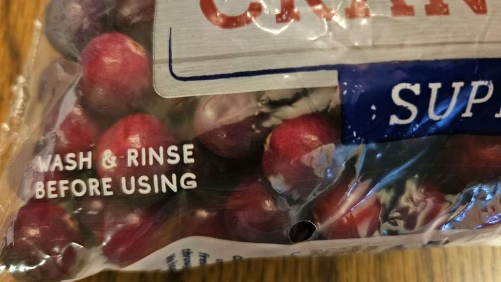 Cranberry package label showing “Wash & Rinse Before Using.”