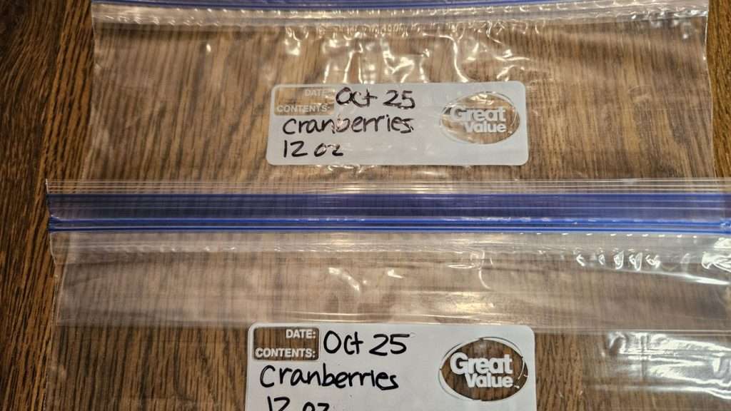 Empty labeled freezer bag marked “12 oz cranberries” and date.